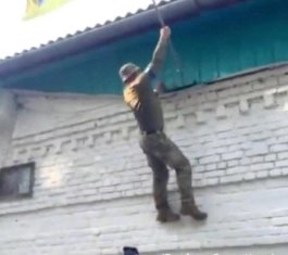 Ukrainian soldiers raise their flag in Kursk Oblast, Russia. 