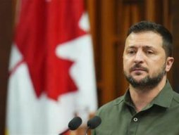 Ukrainian President Volodymyr Zelenskyy in front of a microphone in Canada's Parliament