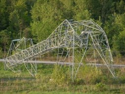 Hydro Ottawa shared this photo on social media showing a toppled Hydro One transmission tower near the Hunt Club Road exit off Highway 417. It's one of four towers Hydro One says were crumpled by storms that hit the area Saturday. (Hydro Ottawa/Twitter)