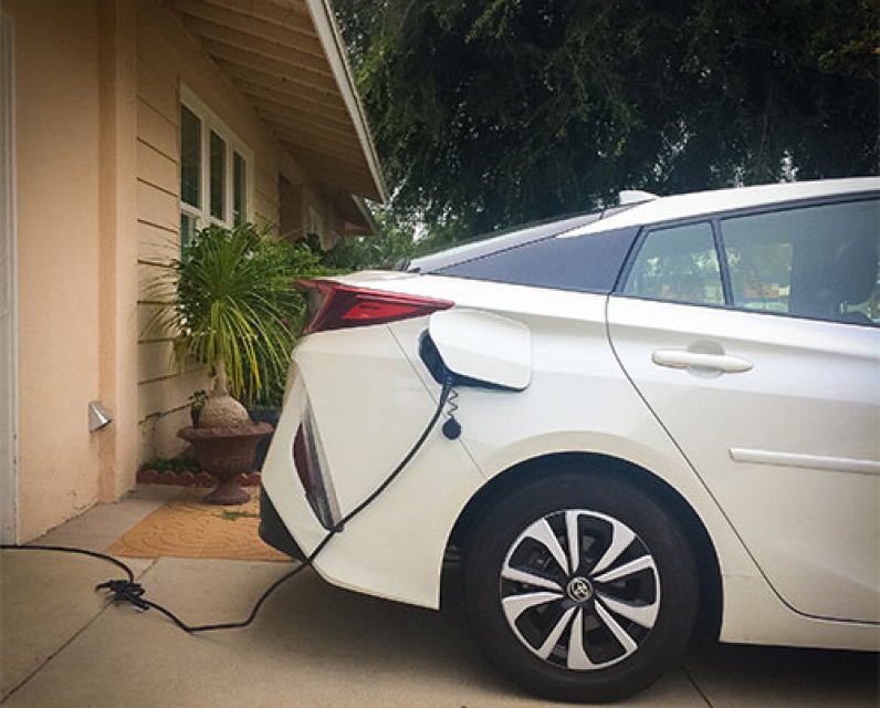 EV plugged into a home electrical outlet