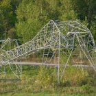 Hydro Ottawa shared this photo on social media showing a toppled Hydro One transmission tower near the Hunt Club Road exit off Highway 417. It's one of four towers Hydro One says were crumpled by storms that hit the area Saturday. (Hydro Ottawa/Twitter)